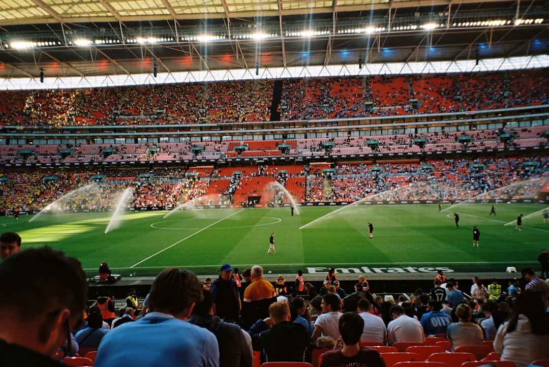 Soccer field being watered during a match