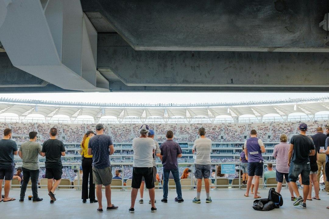 Fans filling a football stadium on matchday