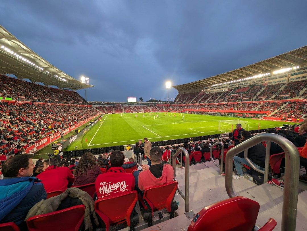 Crowded soccer stadium with fans watching a game