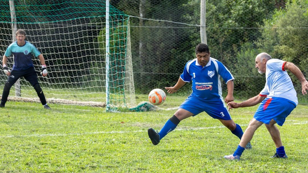 Soccer players competing on a grassy field