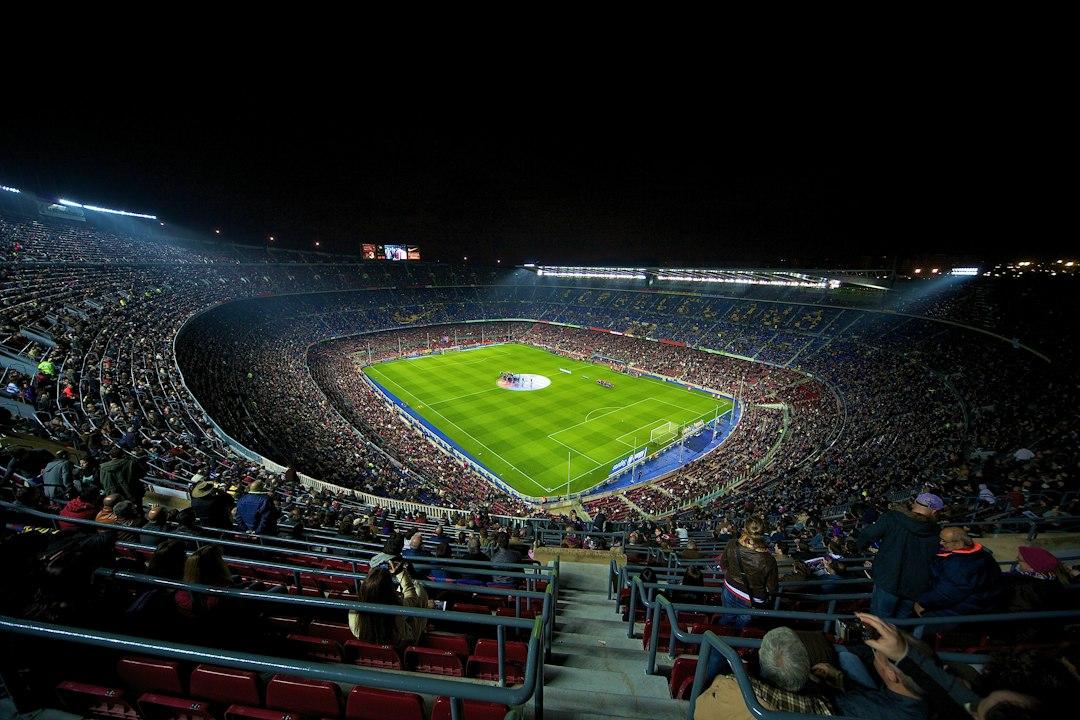 A packed stadium watching a football match