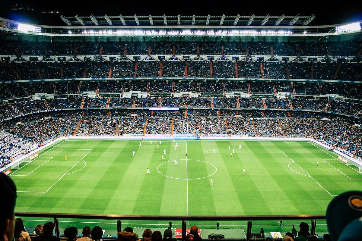 A professional stadium pitch under the lights