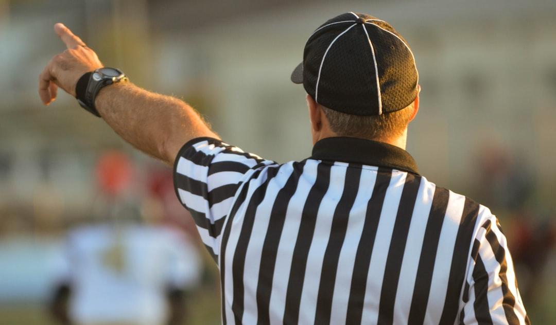 A referee in the middle of a big decision