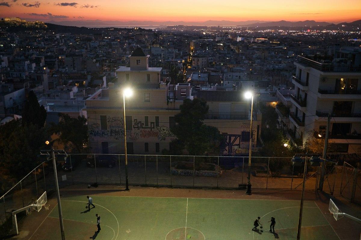 A football match under stadium floodlights
