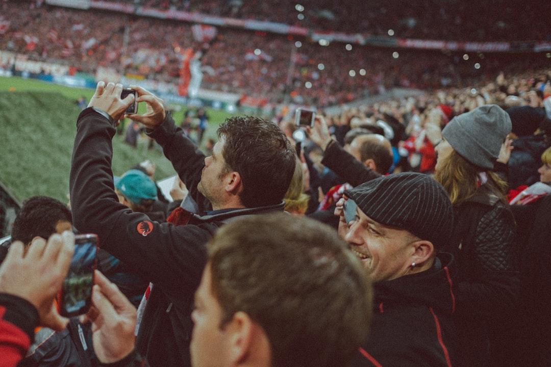 Fans using smartphones at Allianz Arena in Munich during a match