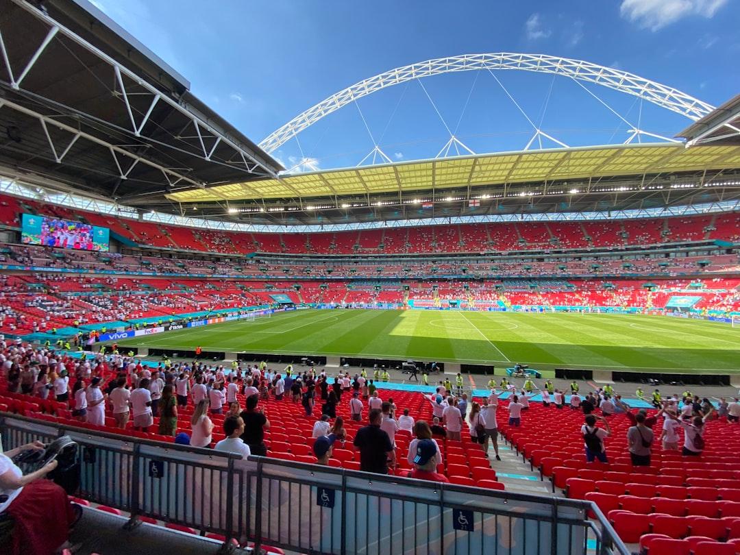 Football fans inside Wembley Stadium during a match