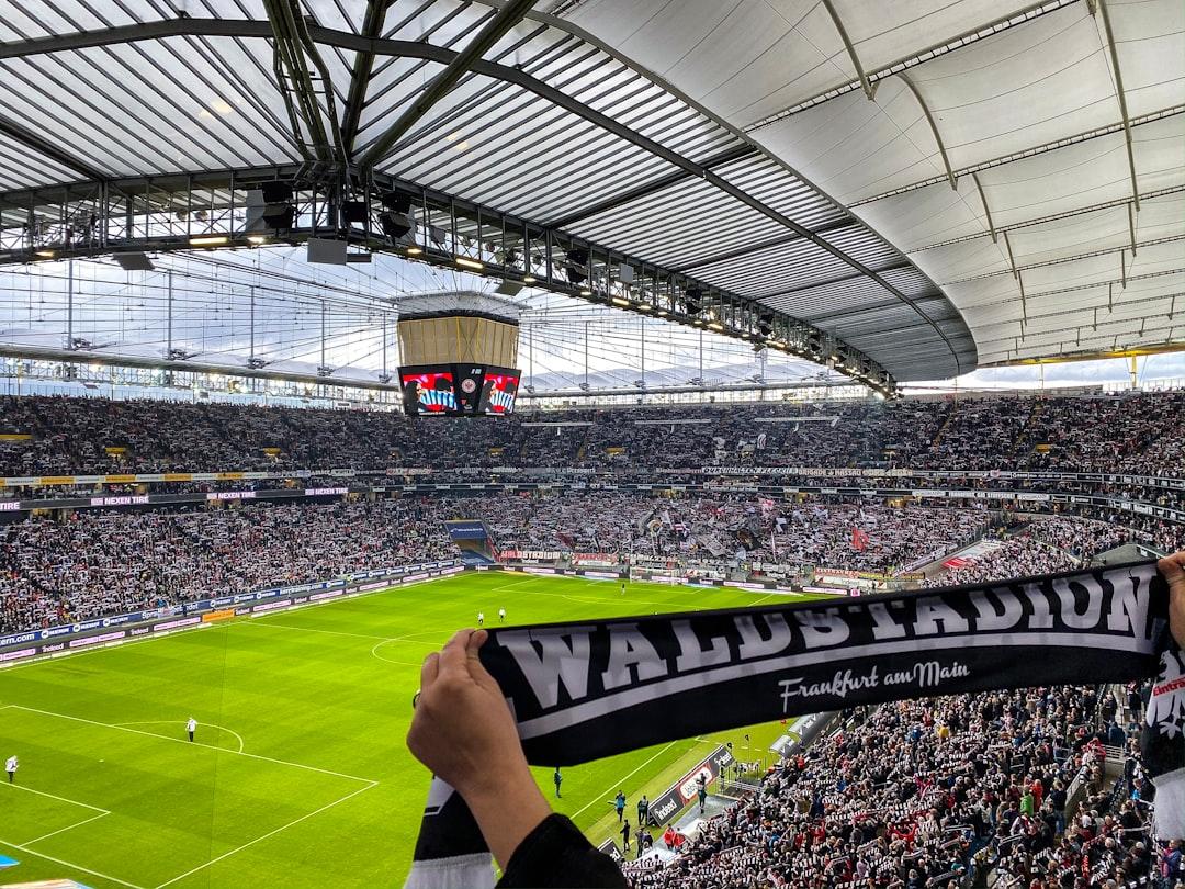 Fans watching a soccer game together in a stadium