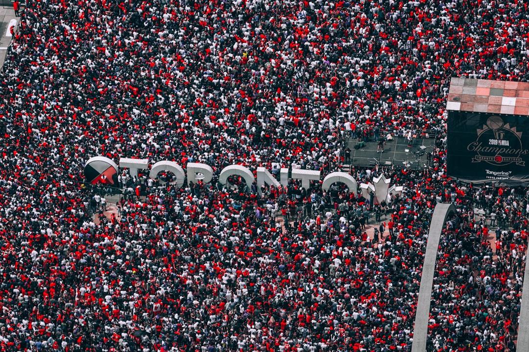A large crowd of football fans gathered together in a stadium