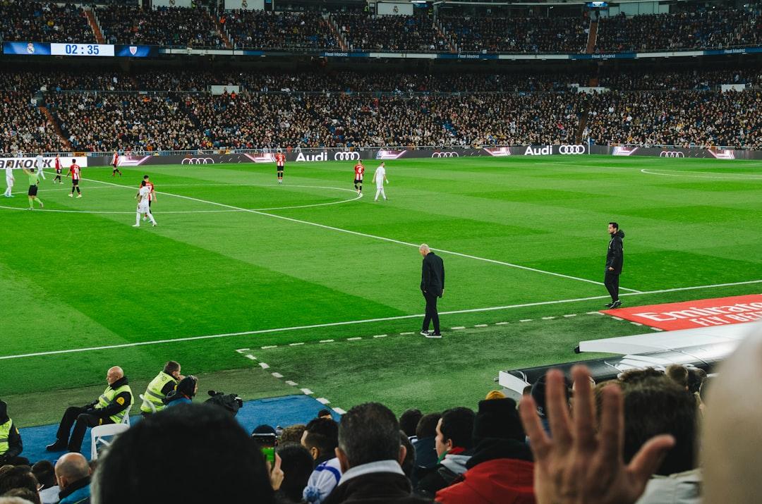 Fans watching a soccer game at the Santiago Bernabéu stadium
