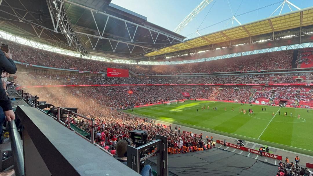 Fans inside a stadium watching a live football match