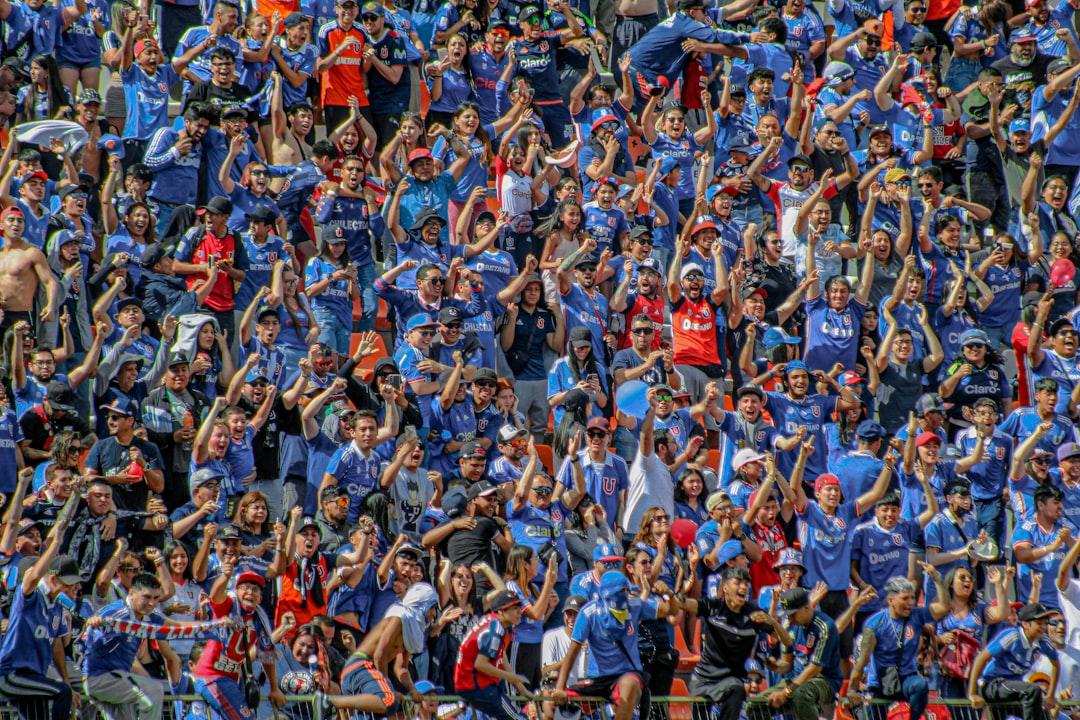 A large group of football fans together in a stadium