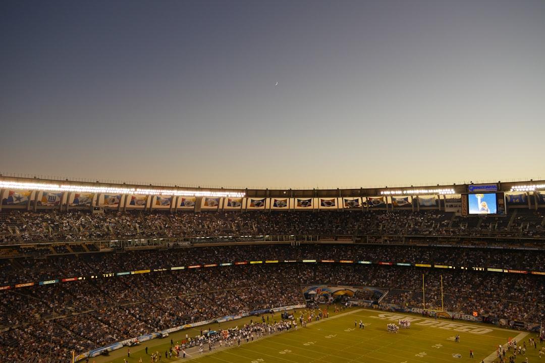 A view of a football pitch and stadium from the field