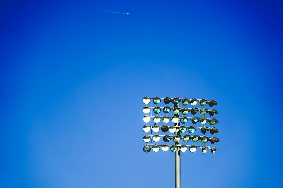 Stadium floodlights glowing above the pitch on a matchday night