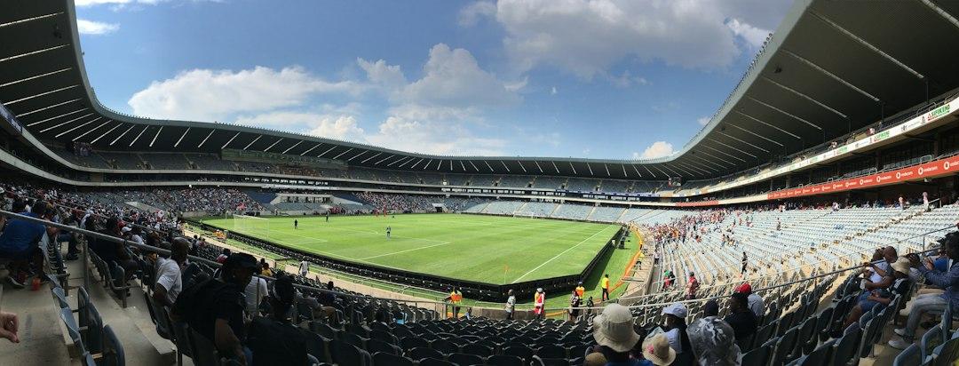 Fans watching a football match from the stands