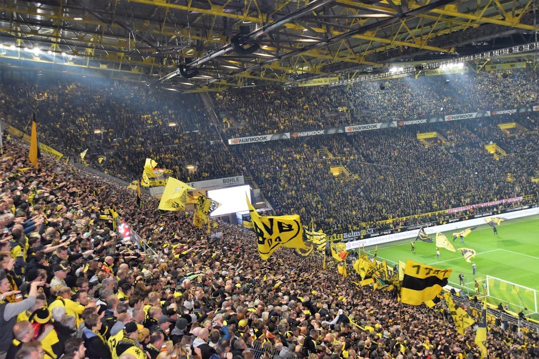 A soccer field under stadium floodlights
