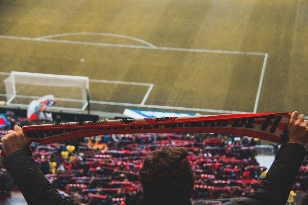 Fans watching a game unfold live in the stadium