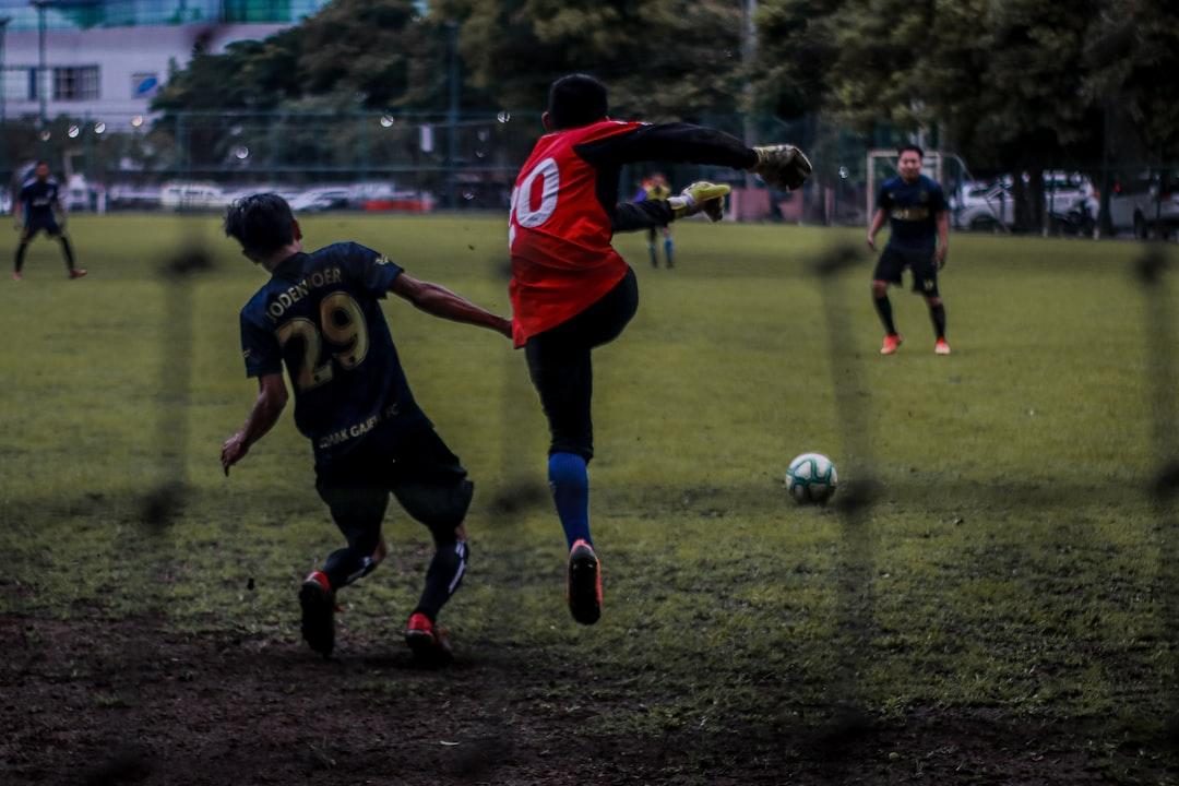 Players contesting a free kick during a match