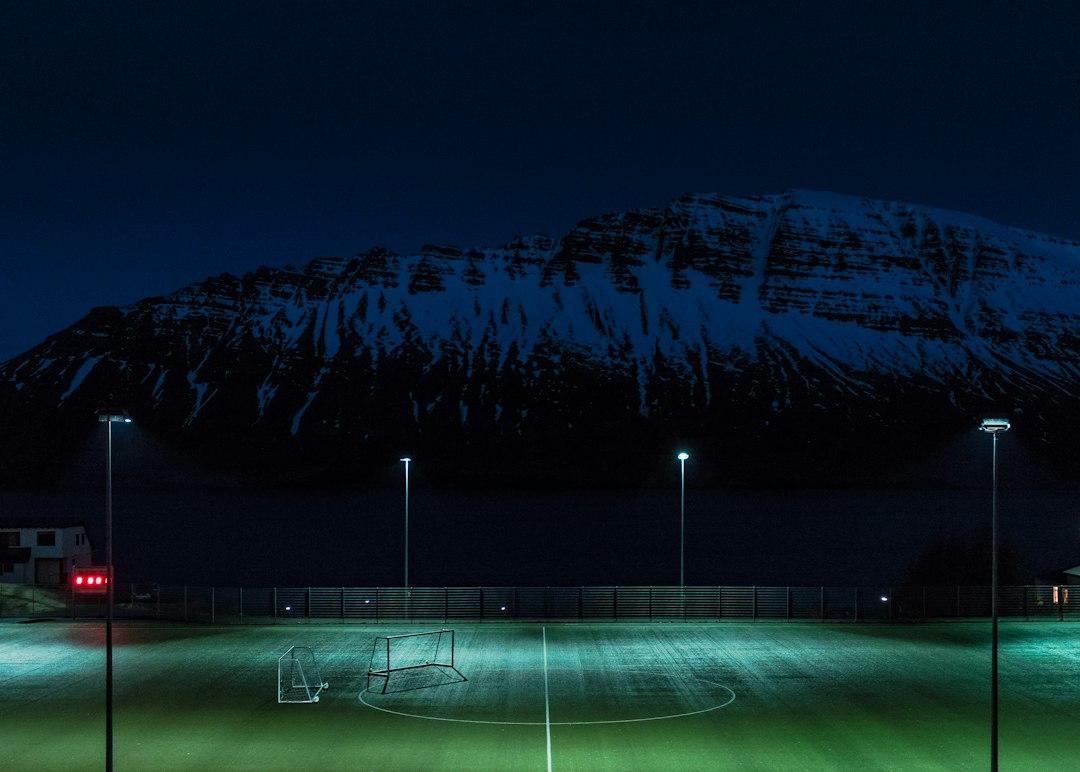Stadium floodlights turned on before a football match