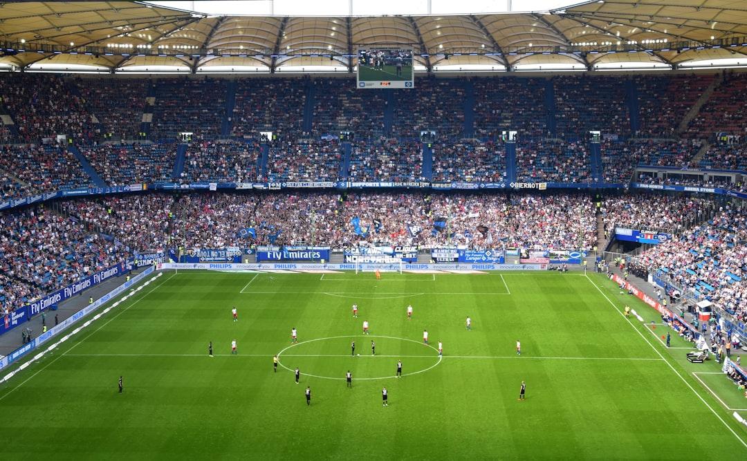Fans inside a soccer stadium watching a match