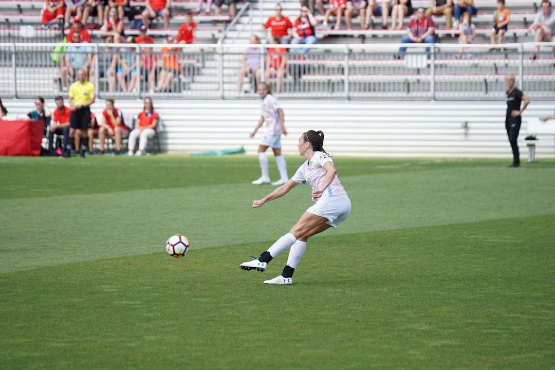 Players lining up for a free kick during a soccer match
