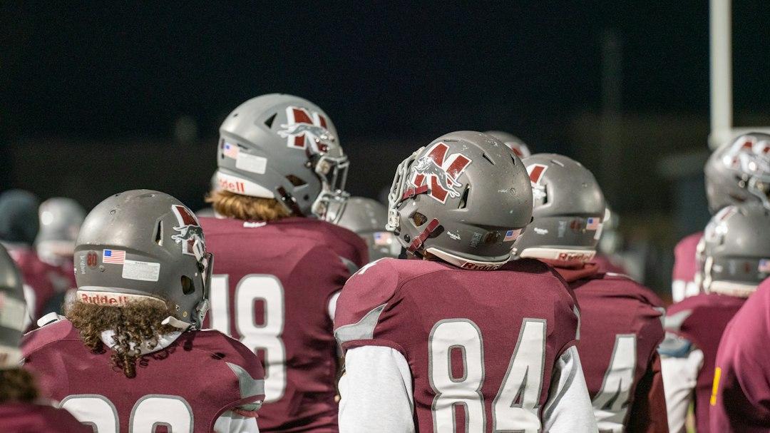 A group of football players standing together on the pitch