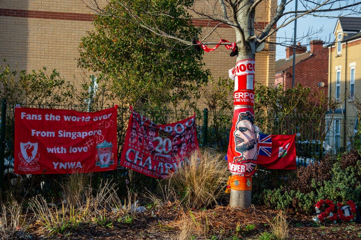 Football fans pay tribute outside a club ground