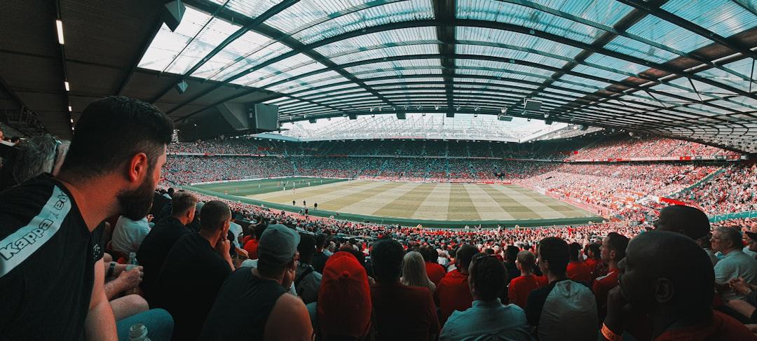 A large crowd of football fans packed into a stadium