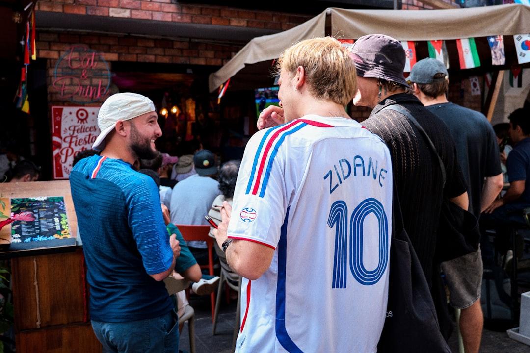 A football shirt worn by a fan, showing a classic soccer jersey design