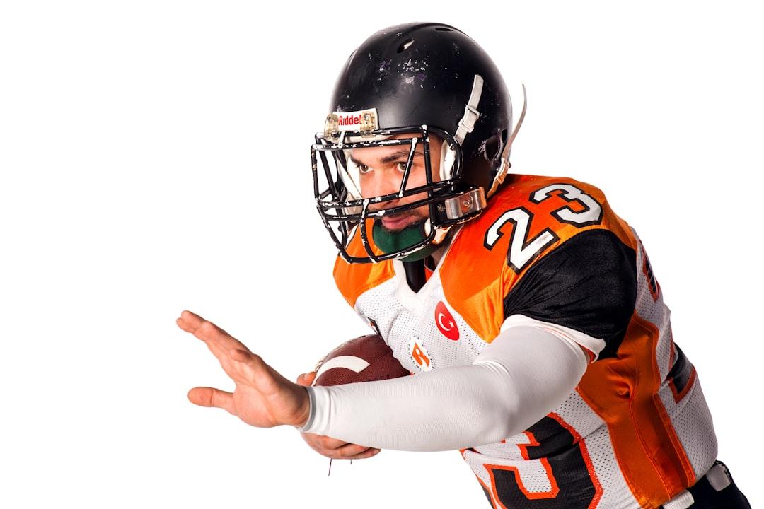 A football player looking for a forward pass