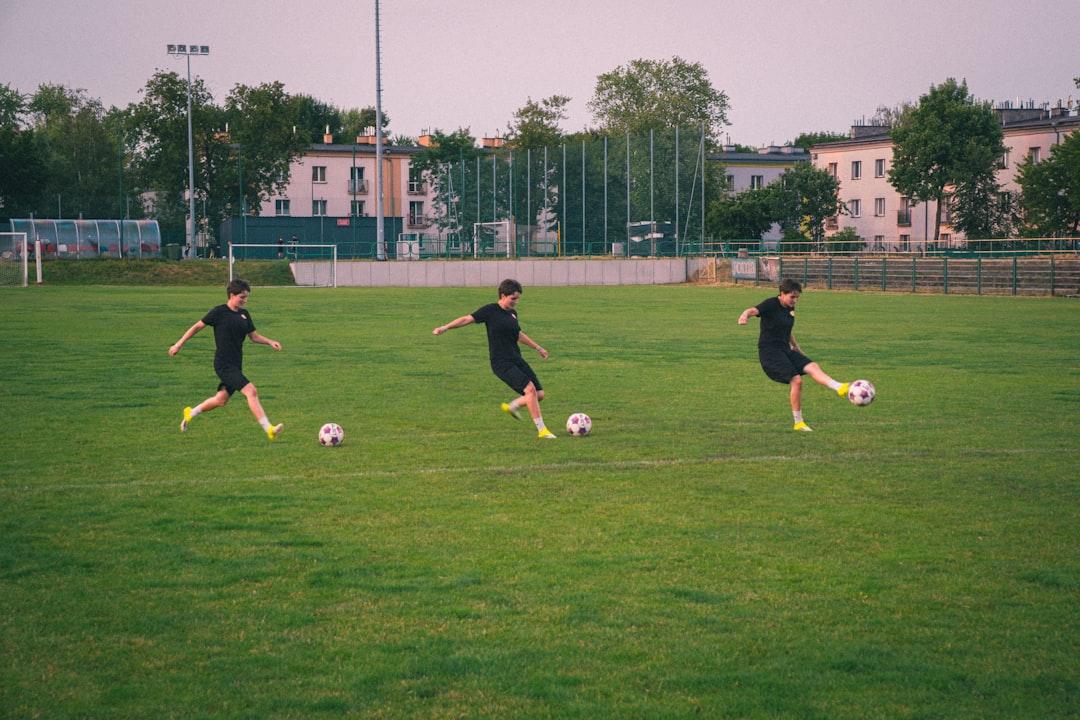 A soccer player striking the ball during a match
