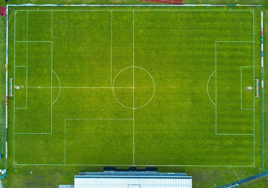 Aerial view of a floodlit soccer pitch