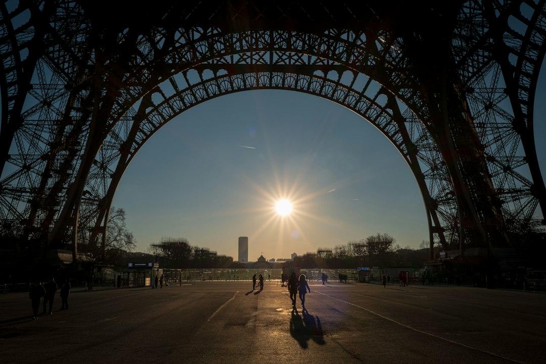 Fans walking beneath the Eiffel Tower in Paris