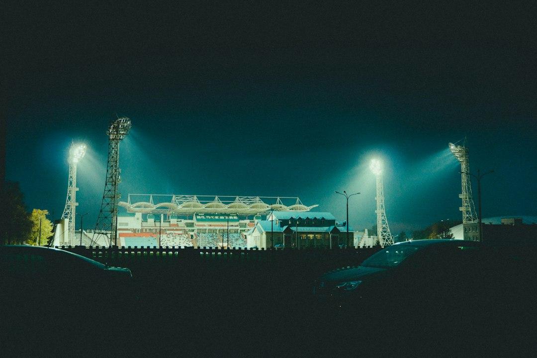 A football stadium lit up at night before kickoff