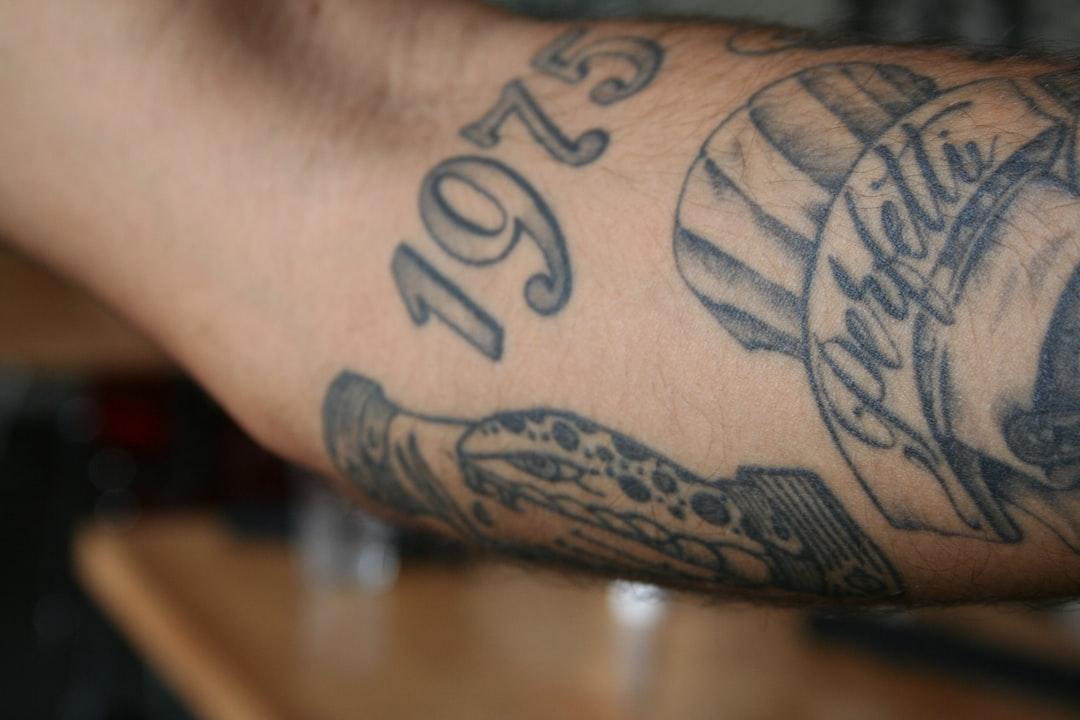 Close up of a tattooed arm with the year 1975